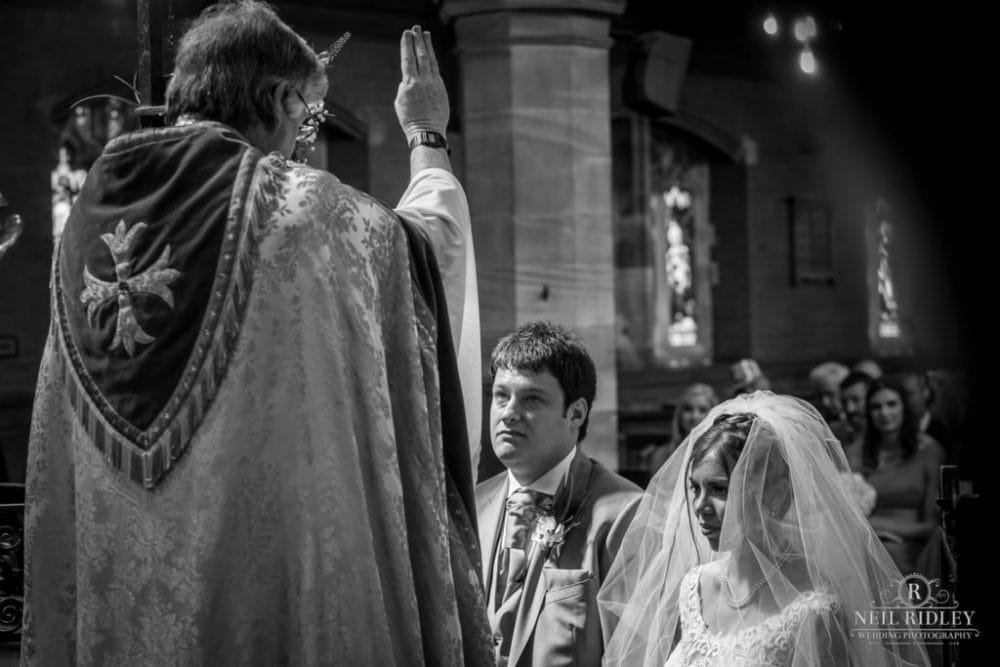 Bride and groom at the Altar St Thomas Church in St Annes-on-Sea