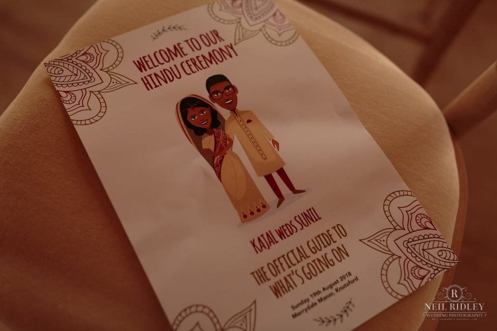 Merrydale Manor Wedding Photographer - Hindu Wedding Guide on a chair