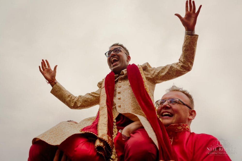 Merrydale Manor Wedding Photographer - Groom being carried on shoulders