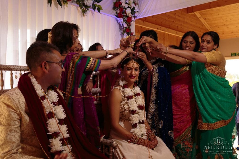 Merrydale Manor Wedding Photographer - Bride receives blessings