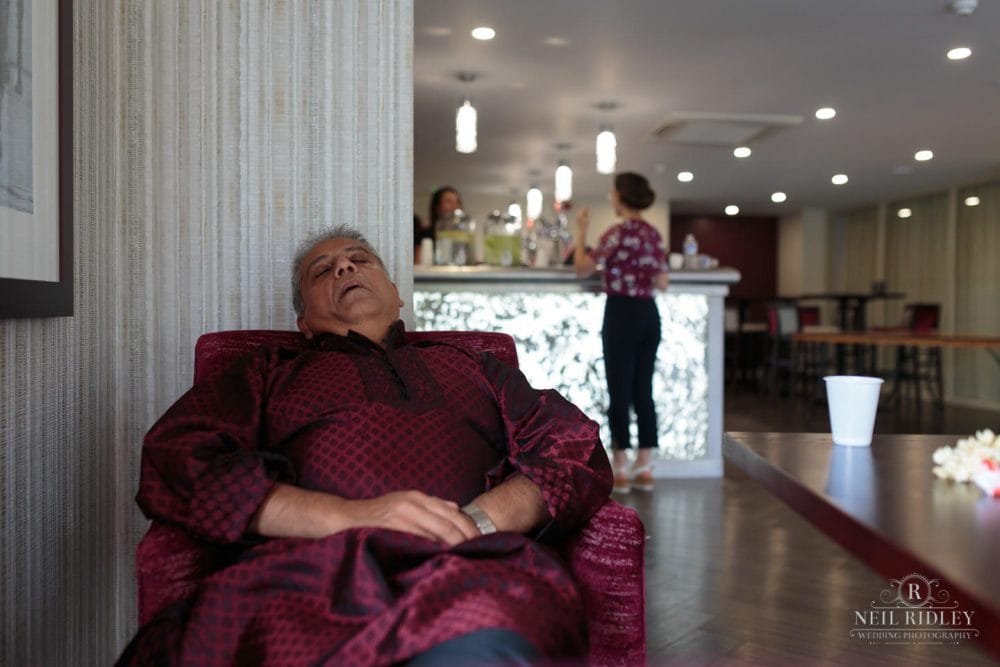 Merrydale Manor Wedding Photographer - Guest asleep in the bar