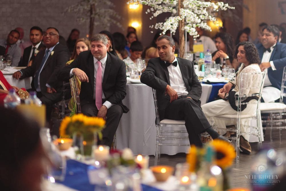 Merrydale Manor Wedding Photographer - Table of Wedding Guests listen to speeches