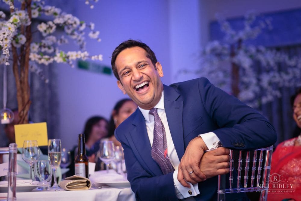 Merrydale Manor Wedding Photographer - Wedding guest laughs during the speeches
