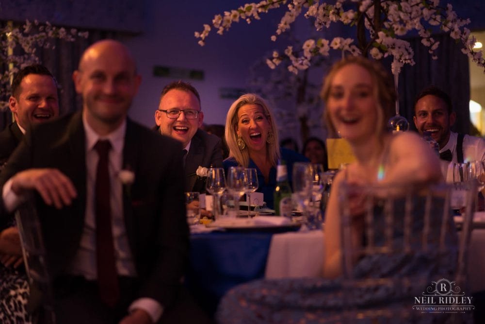 Merrydale Manor Wedding Photographer - Wedding guests laugh during speeches