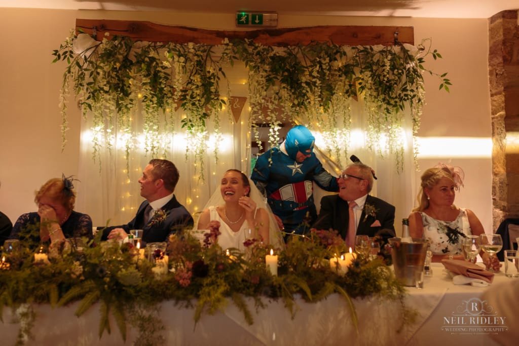 Best man dressed as a Super Hero makes his entrance at Beeston Manor