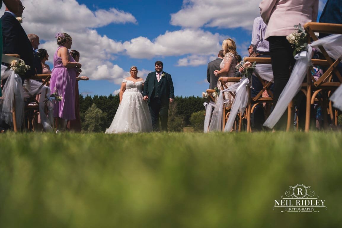 NR900176 Delamere Wedding Photographer Walking down the aisle