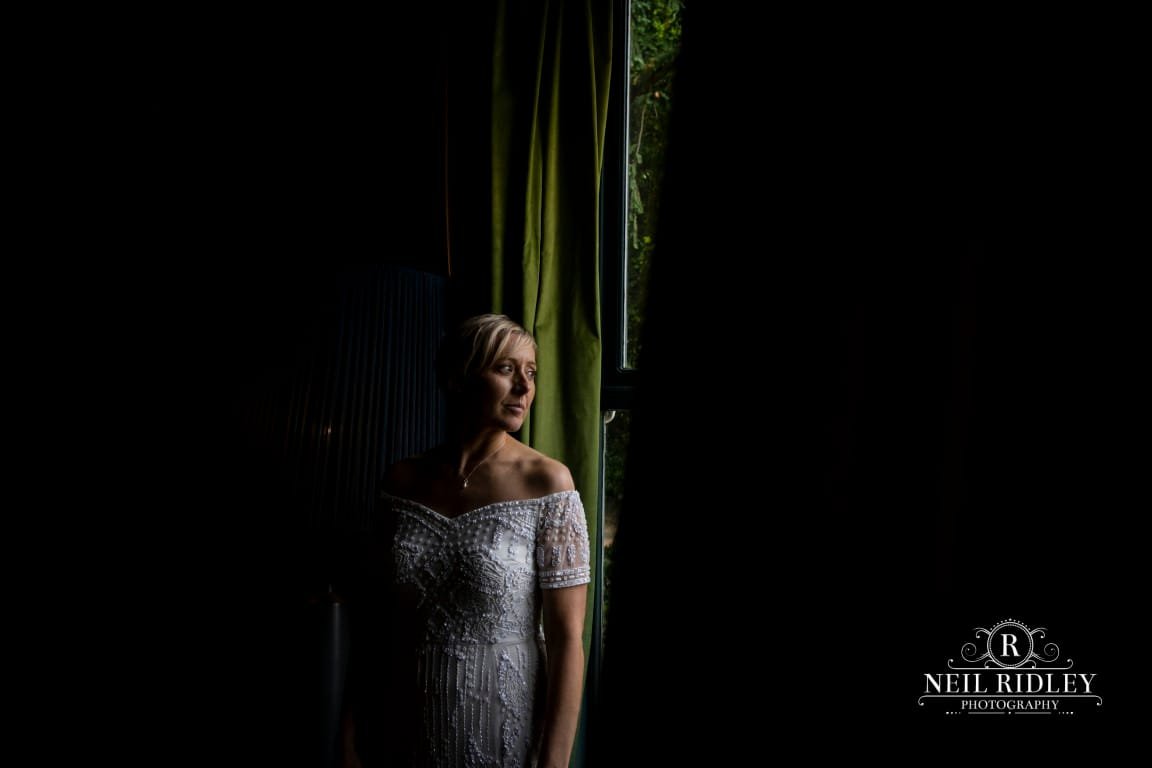 Didsbury House Wedding Photographer bride in window