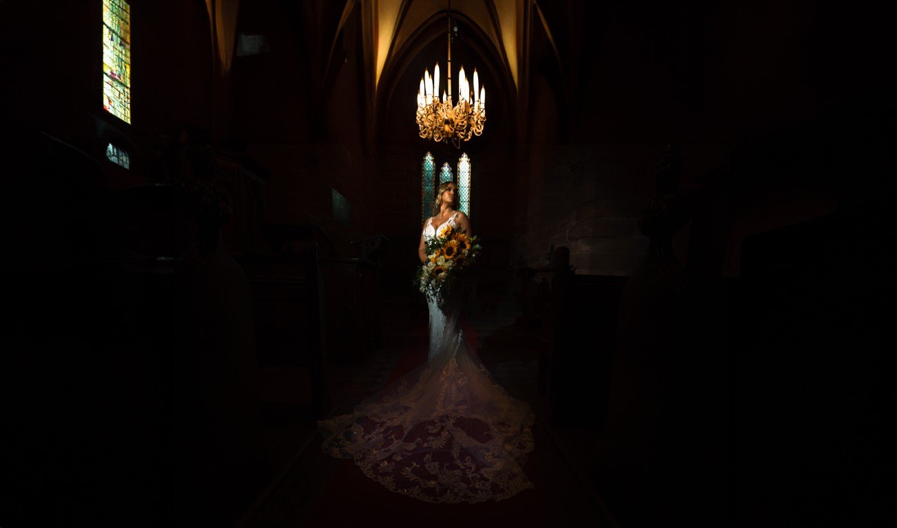 NR904084-Edit Peckforton Castle Wedding Bride poses in chapel