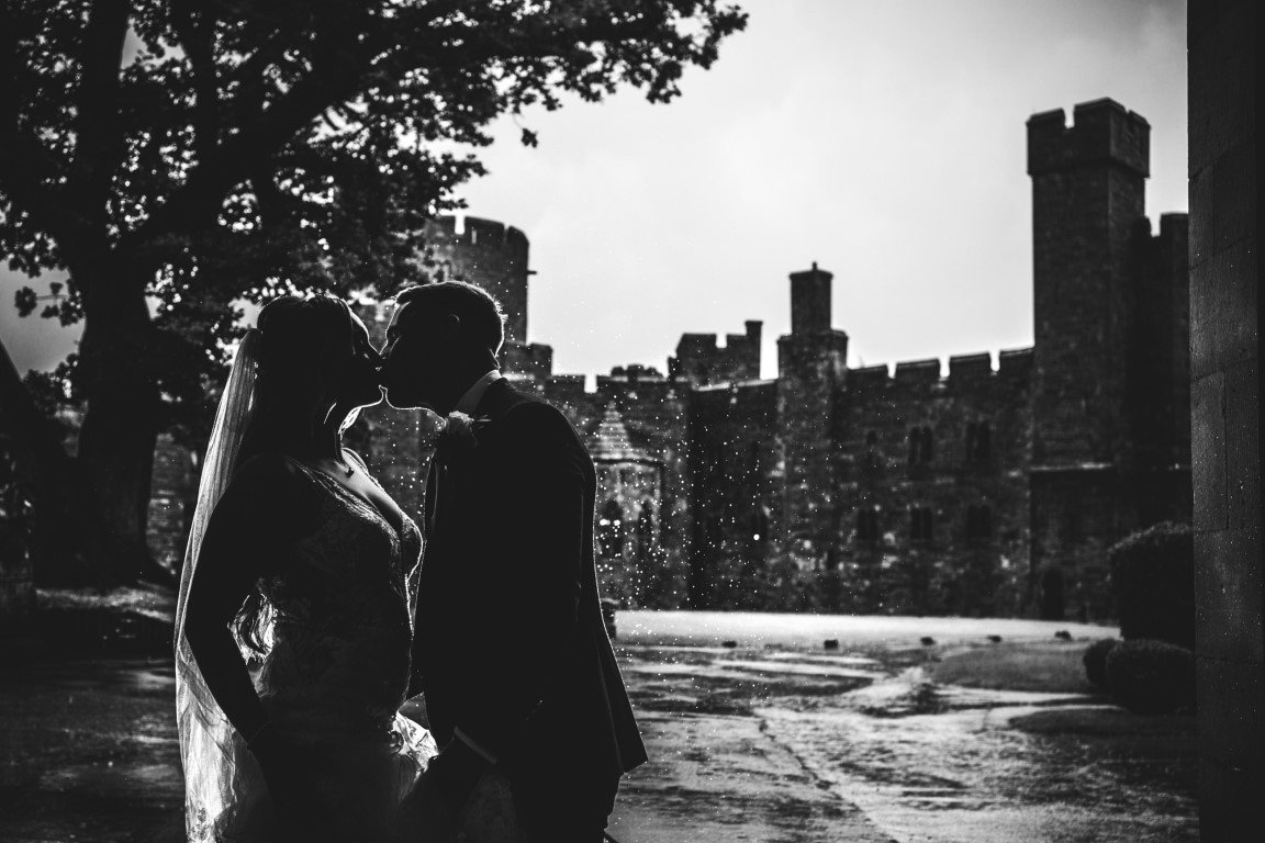 NR904190 Peckforton Castle Wedding Bride and Groom Pose outside in Black and White